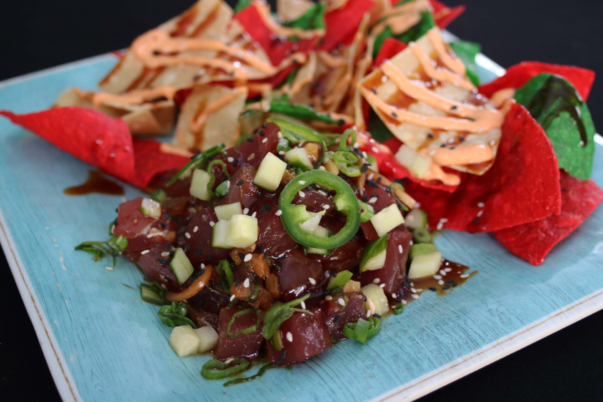 yellowfin tuna tossed with soy sauce, green onion, sesame oil, garlic and rice vinegar with tri-color corn tortilla chips