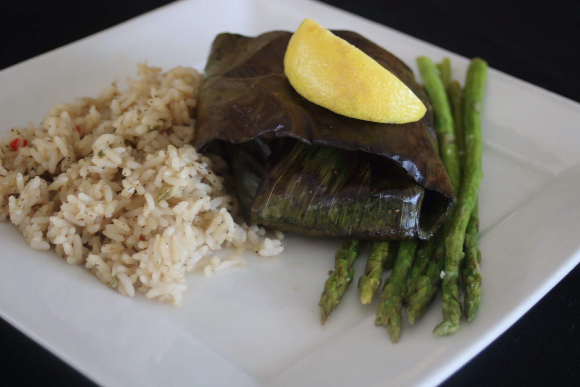 banana leaf wrapped seabass with house rice